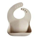Mushie® Bavoir en silicone Shifting Sand