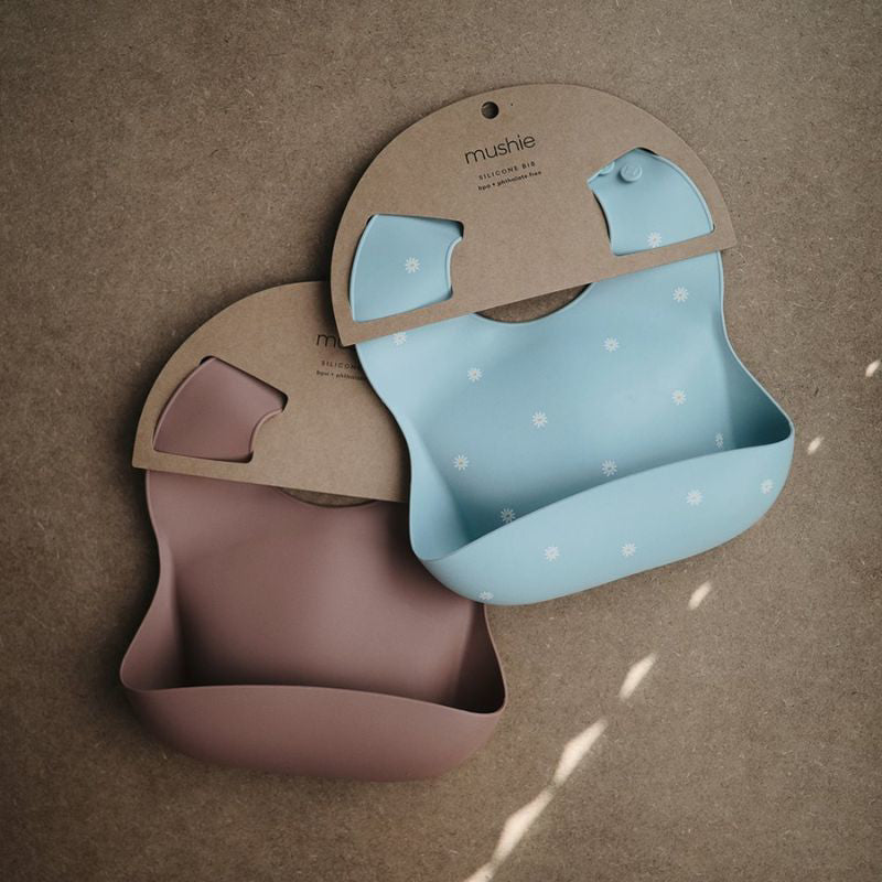 Mushie® Silikonski slinček White Daisy Mushie