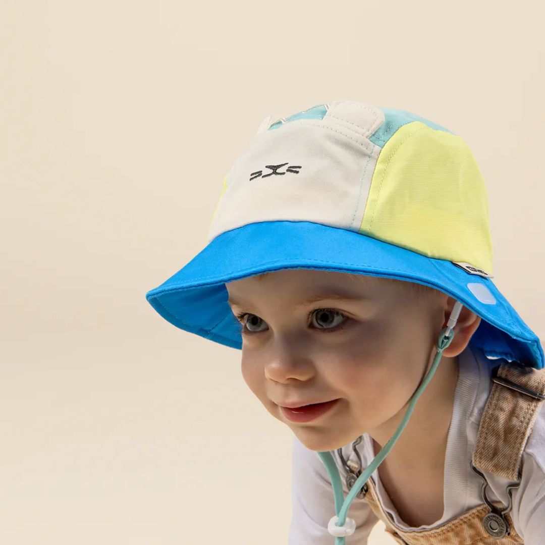 KiETLA® Klobuček Camper Hat Lion Vert Yellow Blue Ki ET LA