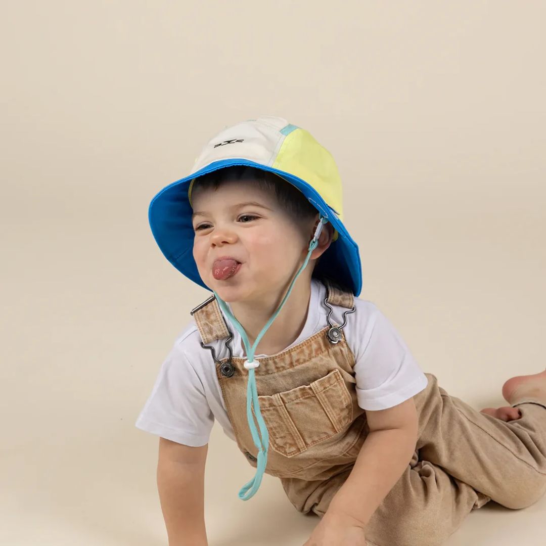 KiETLA® Klobuček Camper Hat Lion Vert Yellow Blue Ki ET LA