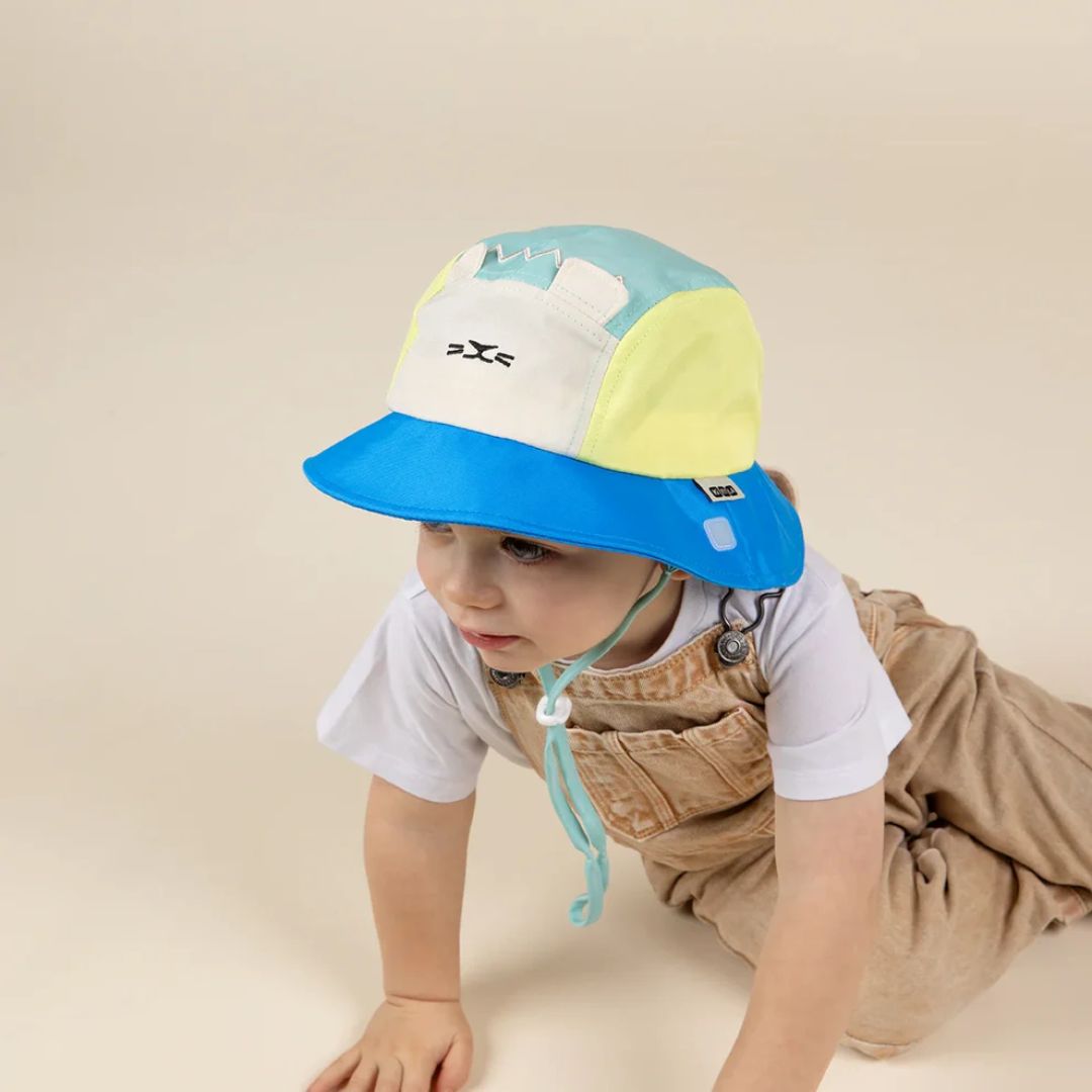 KiETLA® Klobuček Camper Hat Lion Vert Yellow Blue Ki ET LA